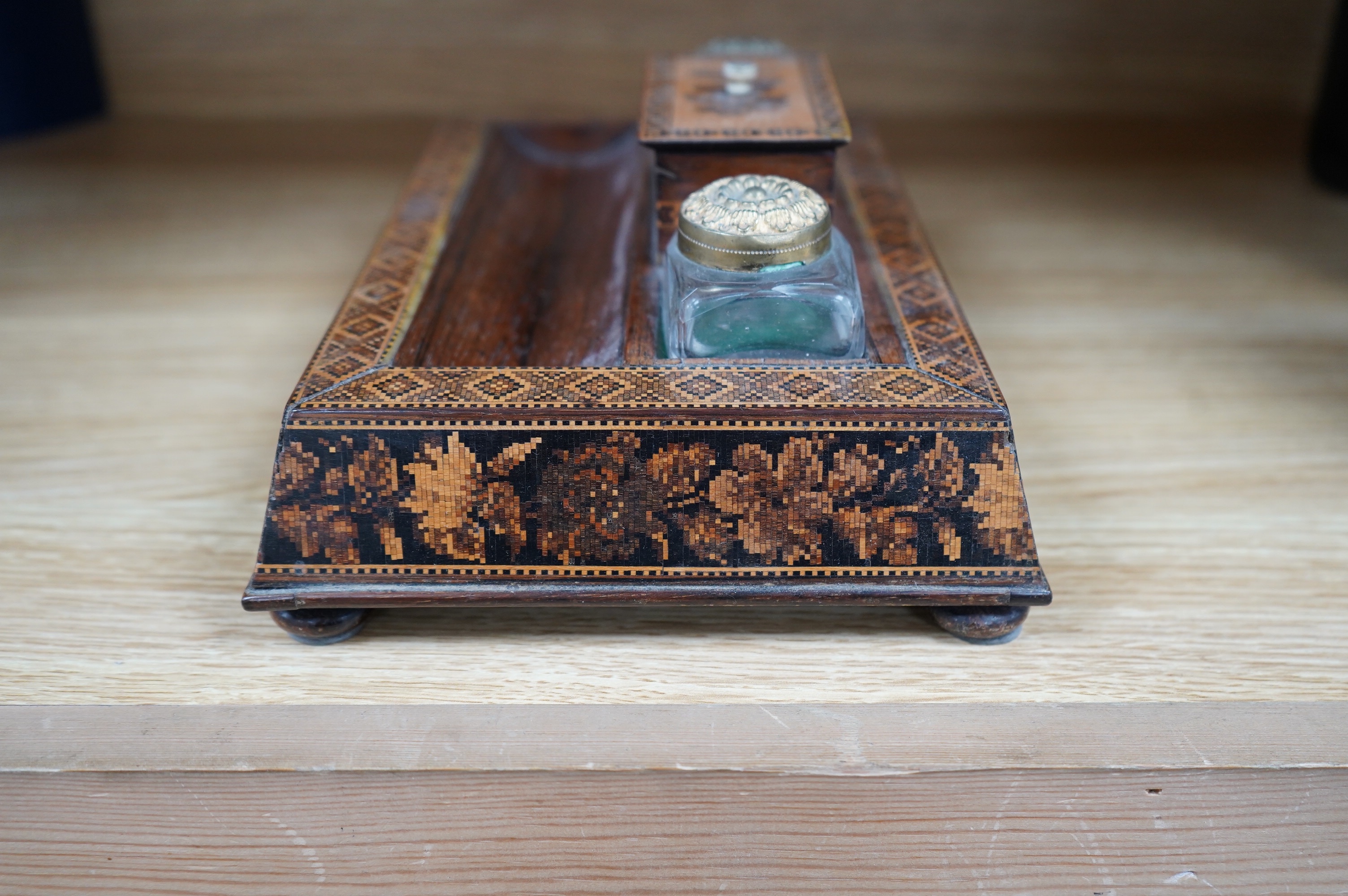 A Tunbridge ware rosewood inkstand with two glass ink bottles, 26cm wide. Condition - fair